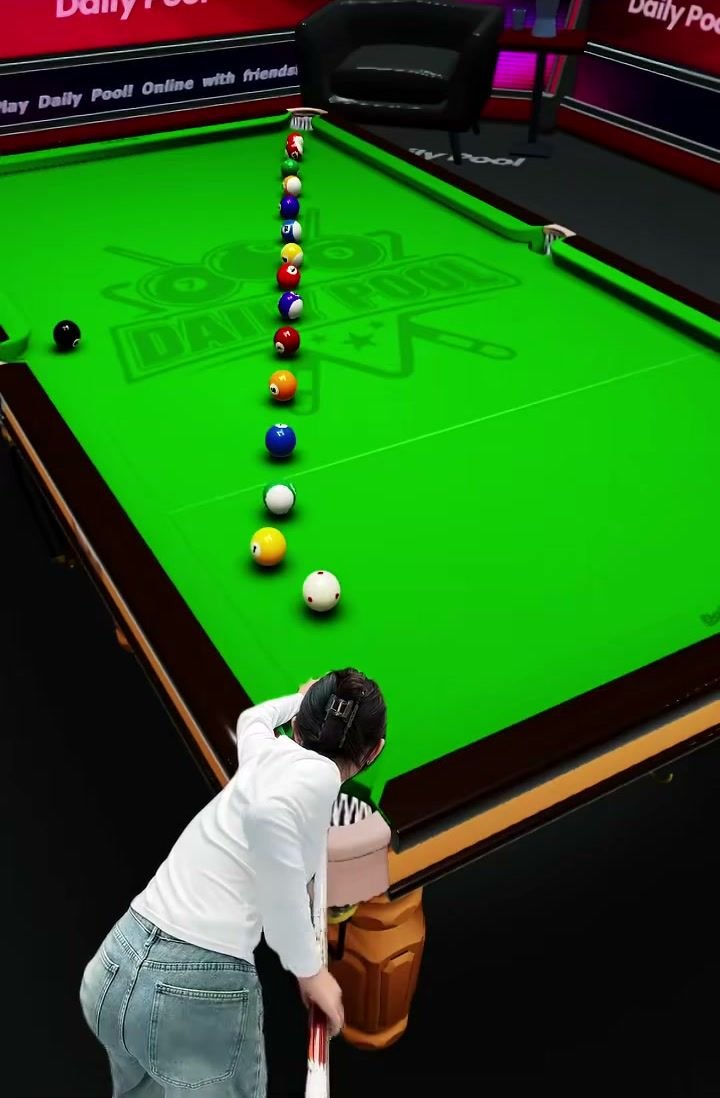 A pool table seen from above, a shot in progress